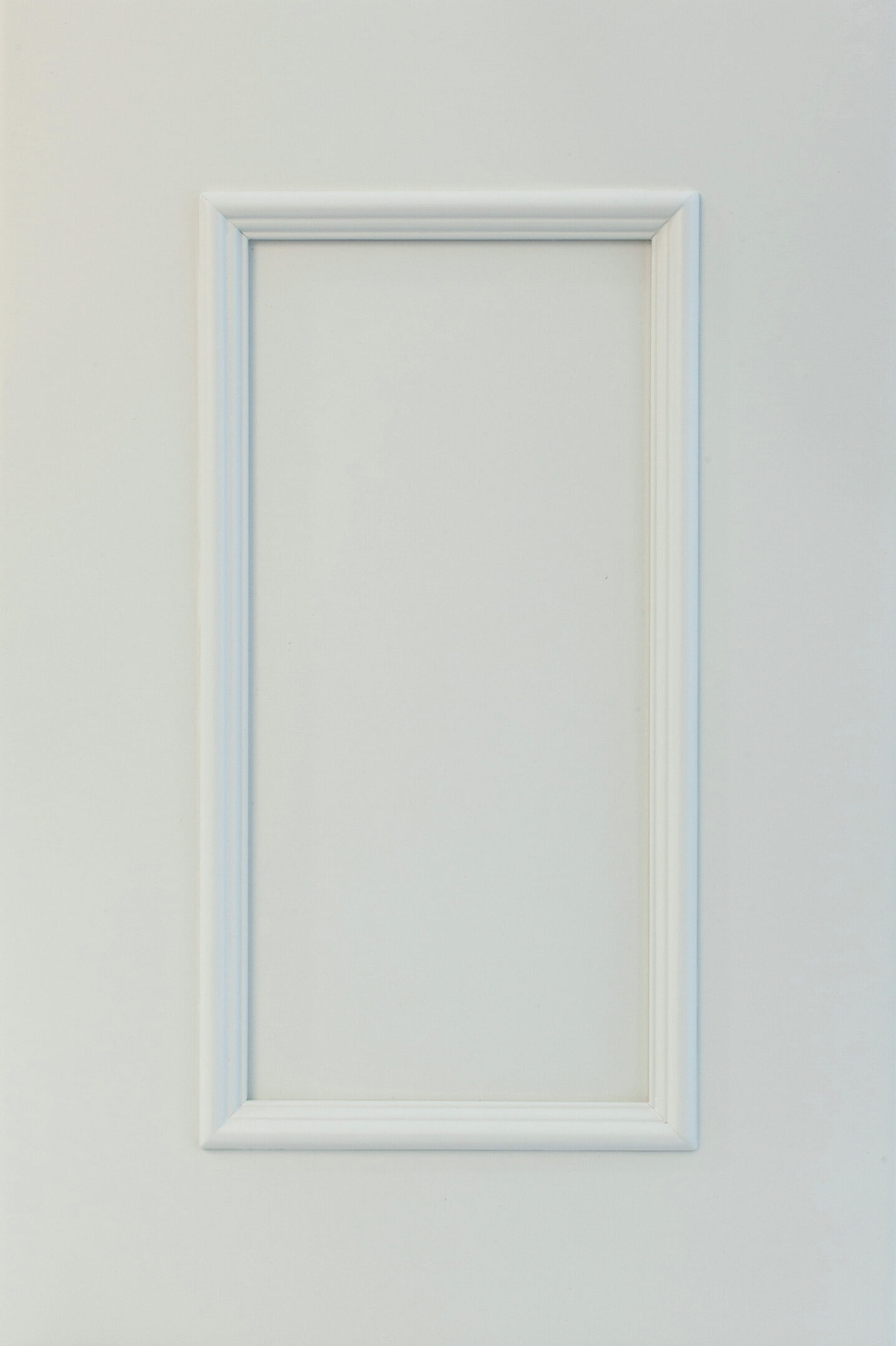 White picture frame on a plain background.