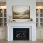 Elegant fireplace with cabinets and landscape painting