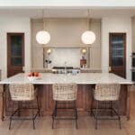Contemporary kitchen with island and wicker stools
