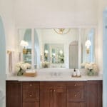 Wooden bathroom vanity with large mirror